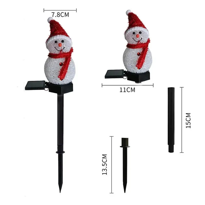 Snowman light glowing at night